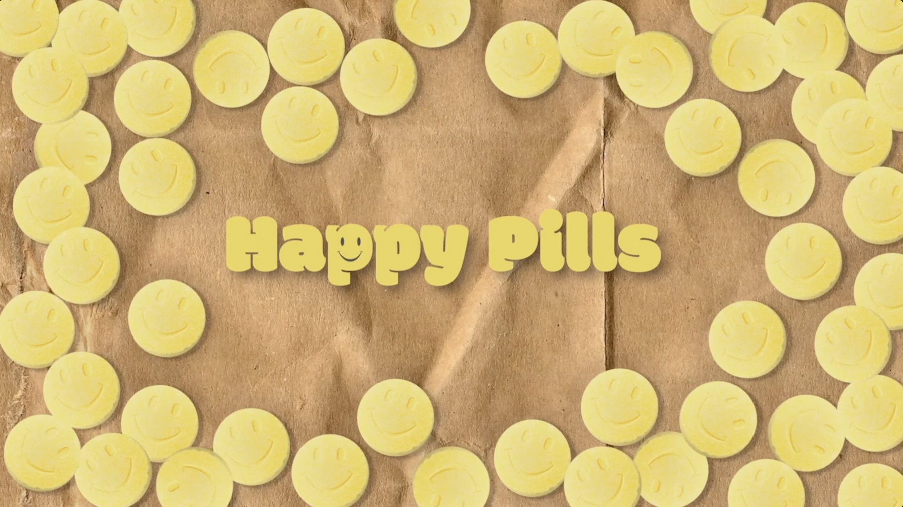 The complete Happy Pills title surrounded by yellow smiley-face tablets